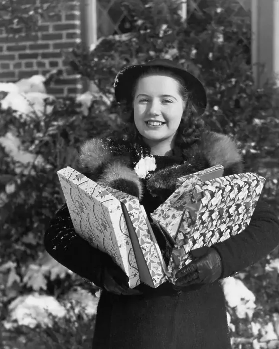 Framed Print : Young Woman Holding Christmas Gifts