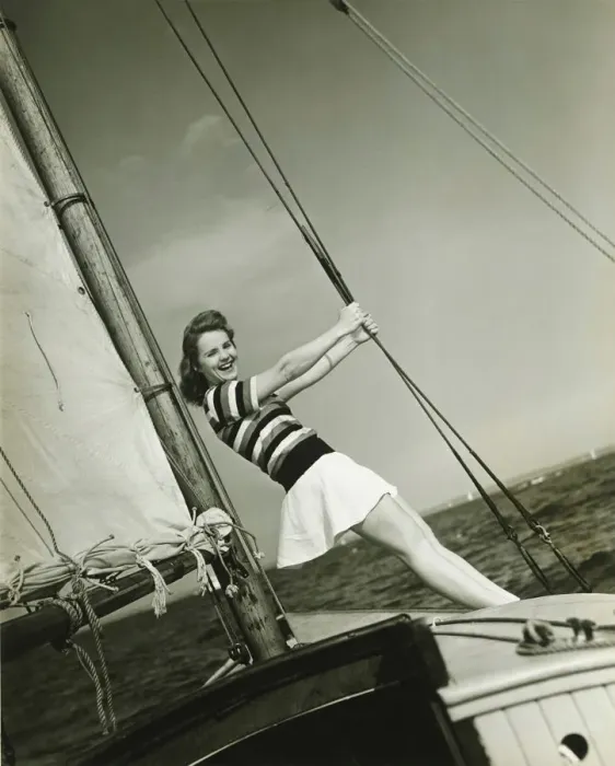 Framed Print : Young woman holding rigging on yacht, (B&W) Framed Print : Young woman holding rigging on yacht, (B&W)