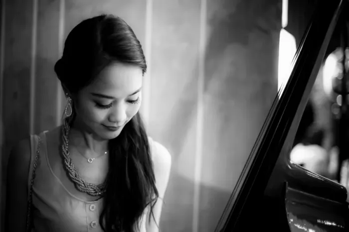 Framed Print : Young woman looking at a Cello
