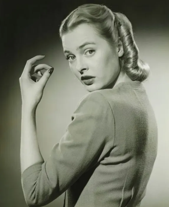 Framed Print : Young woman looking over shoulder, (B&W), portrait