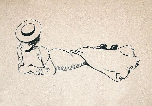 Young woman lying down on her front, wearing long dress, Belle Epoque period, French 1890s, 19th Century