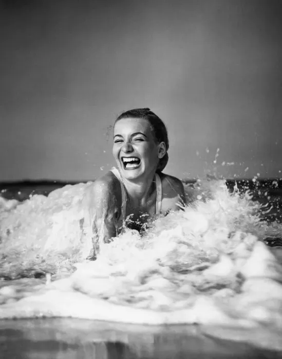 Framed Print : Young woman lying in surf, laughing Framed Print : Young woman lying in surf, laughing