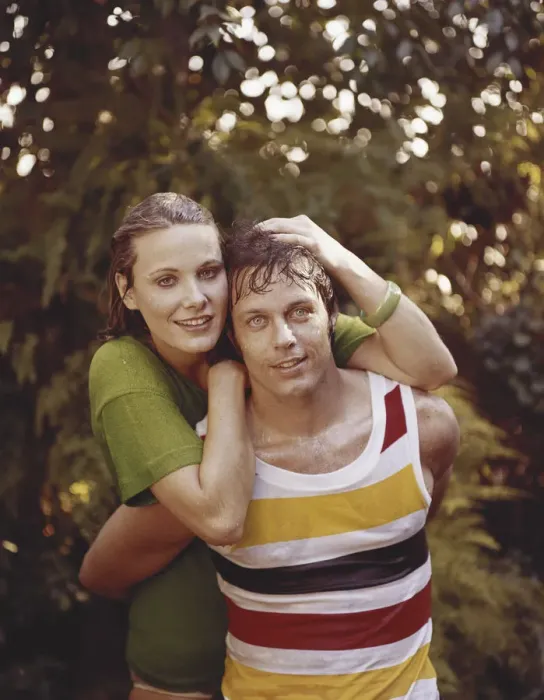 Framed Print : Young woman and man in wet clothes embracing, close-up, portrait, smiling Framed Print : Young woman and man in wet clothes embracing, close-up, portrait, smiling