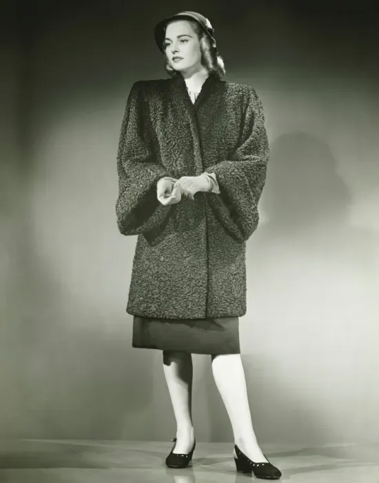 Framed Print : Young woman in Persian lamb coat standing in studio, (B&W) Framed Print : Young woman in Persian lamb coat standing in studio, (B&W)