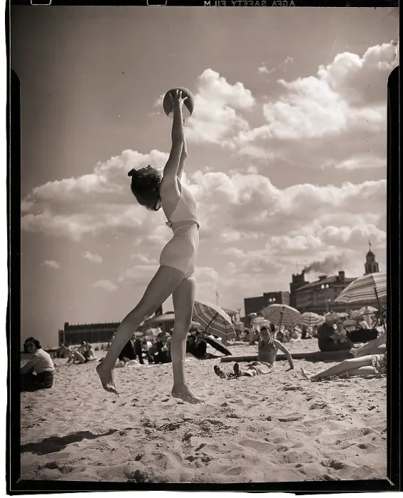 Framed Print : Young Woman Playing Ball On Beach Framed Print : Young Woman Playing Ball On Beach