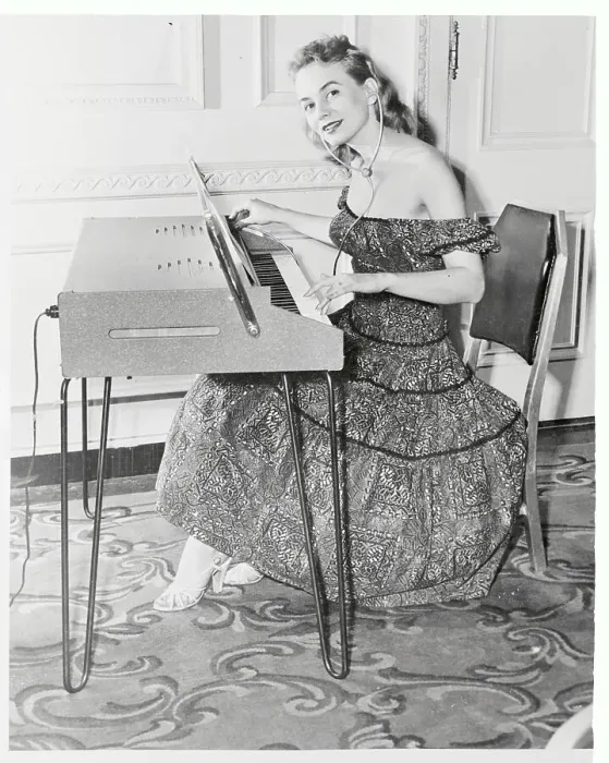 Framed Print : Young Woman Playing Electric Piano Framed Print : Young Woman Playing Electric Piano