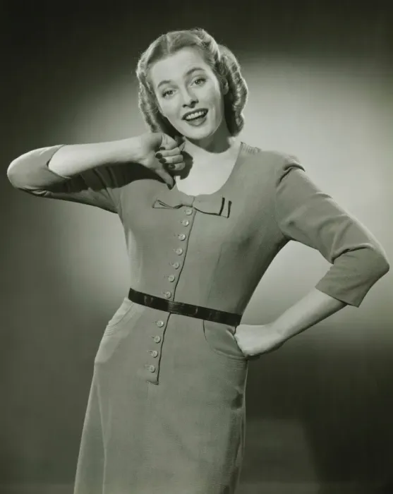 Framed Print : Young woman pointing at herself, posing in studio, (B&W), portrait Framed Print : Young woman pointing at herself, posing in studio, (B&W), portrait