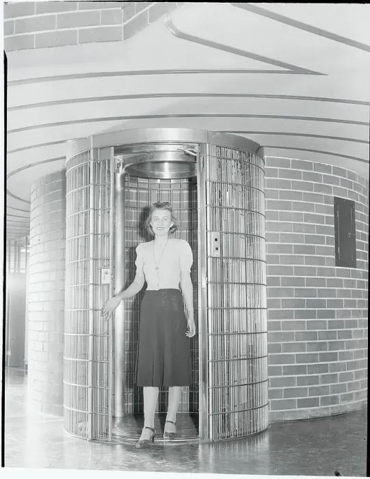 Framed Print : Young Woman Posing Inside Modern Elevator Framed Print : Young Woman Posing Inside Modern Elevator