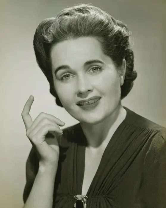 Framed Print : Young woman with raised index finger in studio, (B&W), portrait Framed Print : Young woman with raised index finger in studio, (B&W), portrait