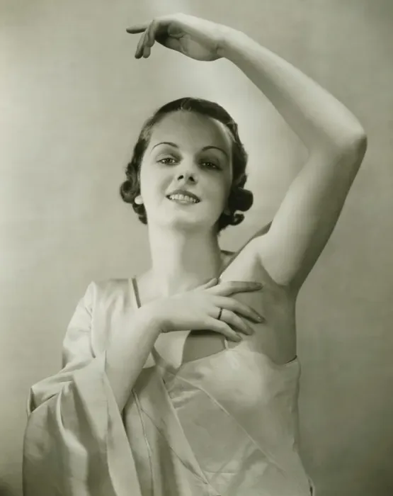 Framed Print : Young woman raising hand, posing in studio, (B&W), portrait Framed Print : Young woman raising hand, posing in studio, (B&W), portrait