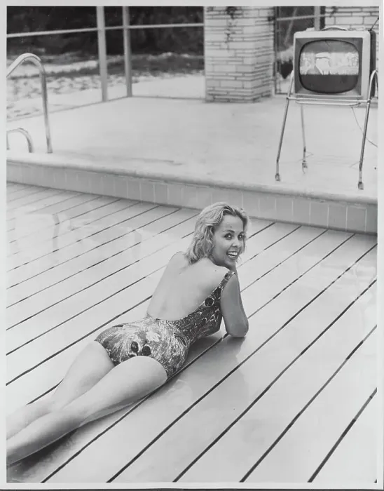Framed Print : Young Woman Relaxing on Swimming Pool Lift