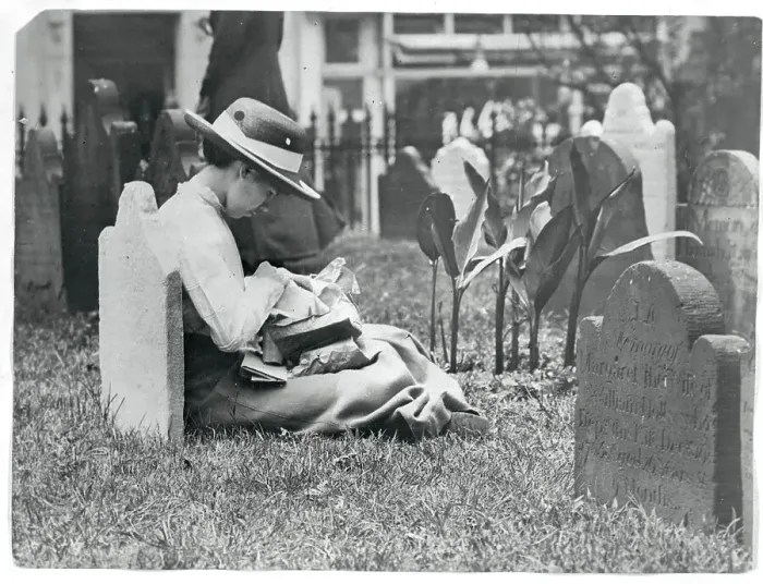 Framed Print : Young Woman Sewing Atop Grave Framed Print : Young Woman Sewing Atop Grave