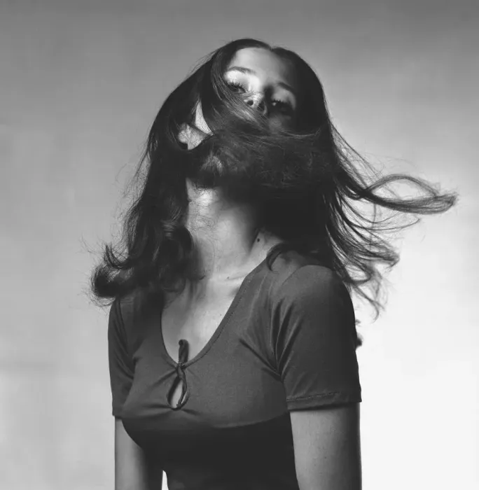 Framed Print : Young woman shaking head in studio, (B&W), portrait Framed Print : Young woman shaking head in studio, (B&W), portrait