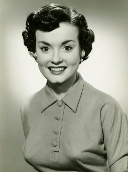 Framed Print : Young woman with short hair smiling, (B&W), portrait Framed Print : Young woman with short hair smiling, (B&W), portrait