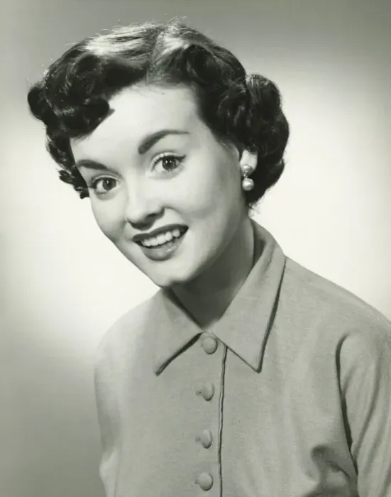 Framed Print : Young woman with short hair smiling, (B&W), portrait Framed Print : Young woman with short hair smiling, (B&W), portrait