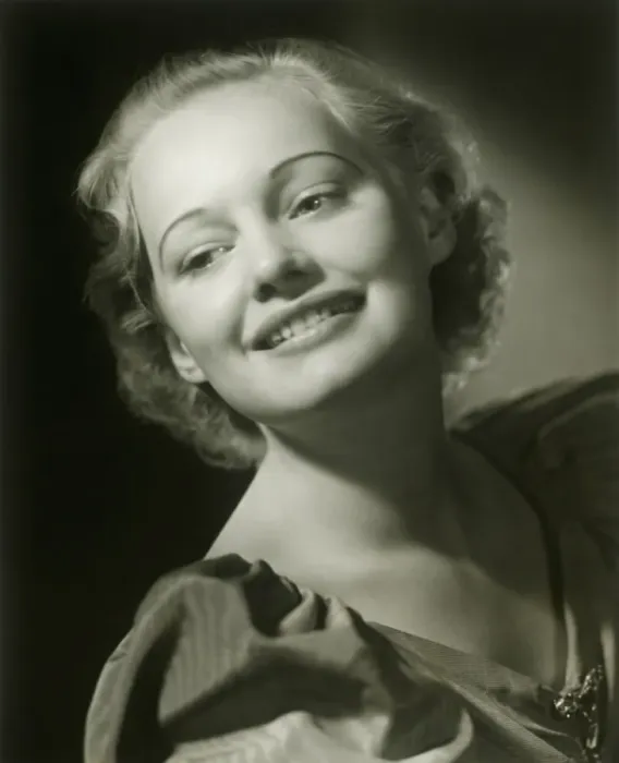 Framed Print : Young woman smiling, close-up, studio shot
