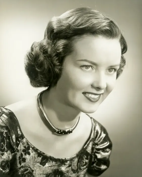 Framed Print : Young woman smiling, close-up, studio shot Framed Print : Young woman smiling, close-up, studio shot