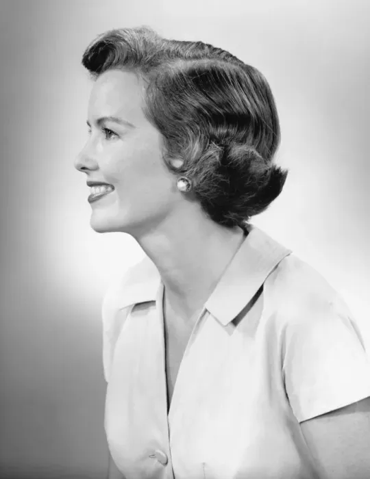 Framed Print : Young woman smiling, posing in studio, (B&W), close-up Framed Print : Young woman smiling, posing in studio, (B&W), close-up