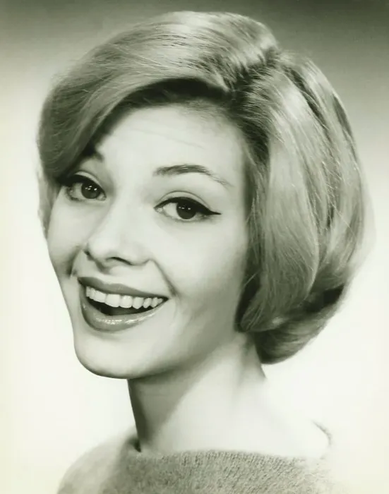 Framed Print : Young woman smiling, posing in studio, (B&W), (Portrait) Framed Print : Young woman smiling, posing in studio, (B&W), (Portrait)
