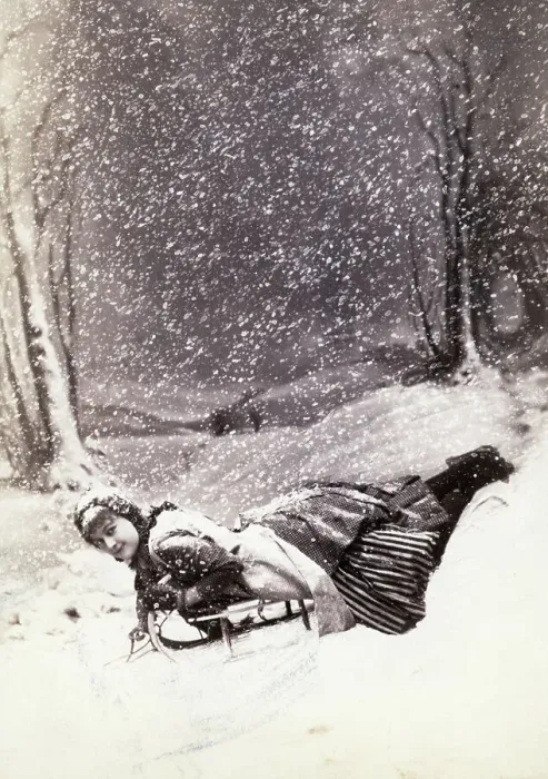 Framed Print : Young Woman Snow-Sledding Framed Print : Young Woman Snow-Sledding