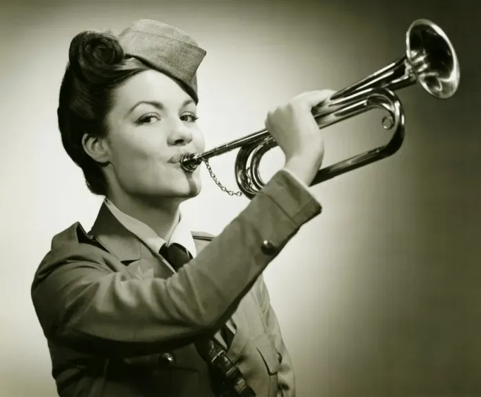 Framed Print : Young woman in soldiers uniform playing on trumpet, (B&W), portrait