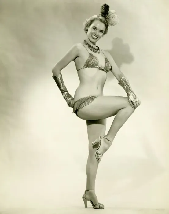 Framed Print : Young woman standing in show girl costume, (B&W) Framed Print : Young woman standing in show girl costume, (B&W)
