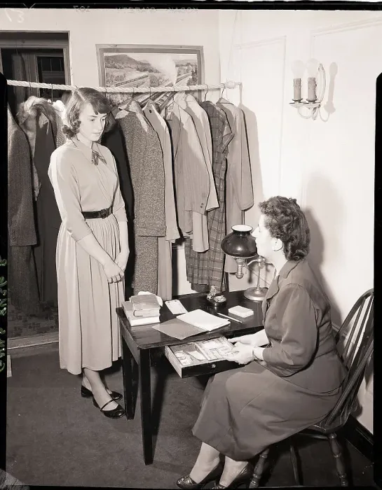 Framed Print : A Young Woman Stands Before Seated Woman Framed Print : A Young Woman Stands Before Seated Woman