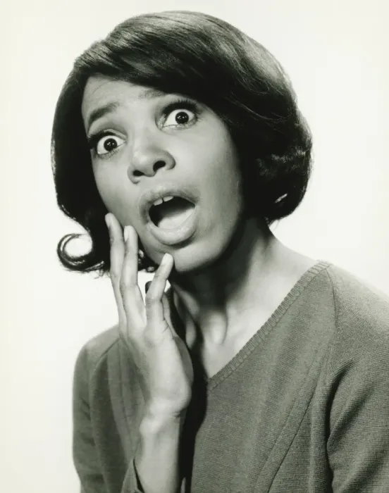 Framed Print : Young woman with surprised expression, (B&W), close-up Framed Print : Young woman with surprised expression, (B&W), close-up