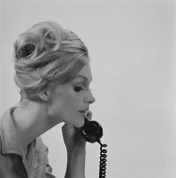 Young woman talking on phone, close-up