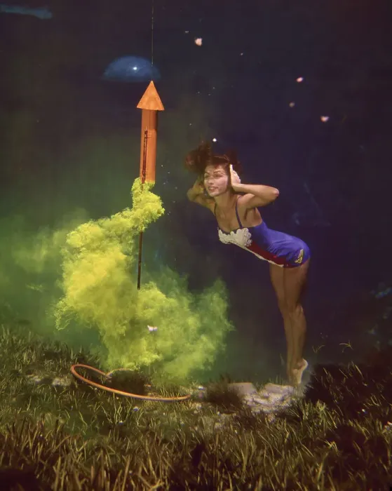 Framed Print : Young Woman Underneath Water with Flaring Rocket Framed Print : Young Woman Underneath Water with Flaring Rocket