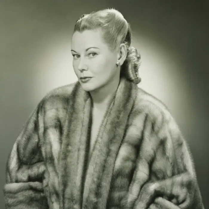 Framed Print : Young woman wearing fur coat in studio, (B&W), portrait Framed Print : Young woman wearing fur coat in studio, (B&W), portrait