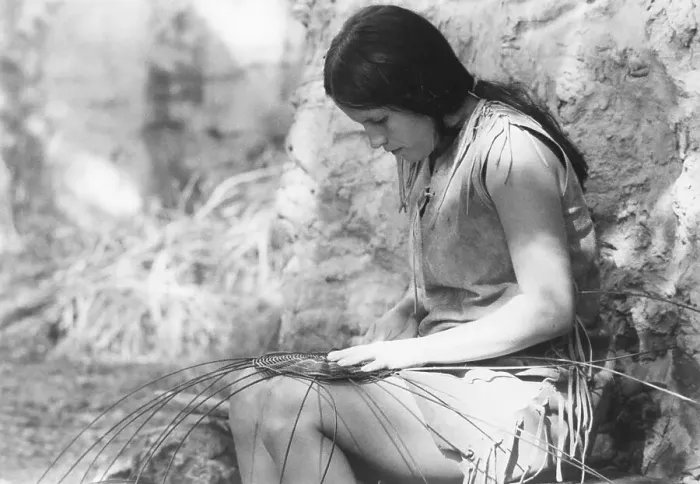 Framed Print : Young Woman Weaving on Her Lap