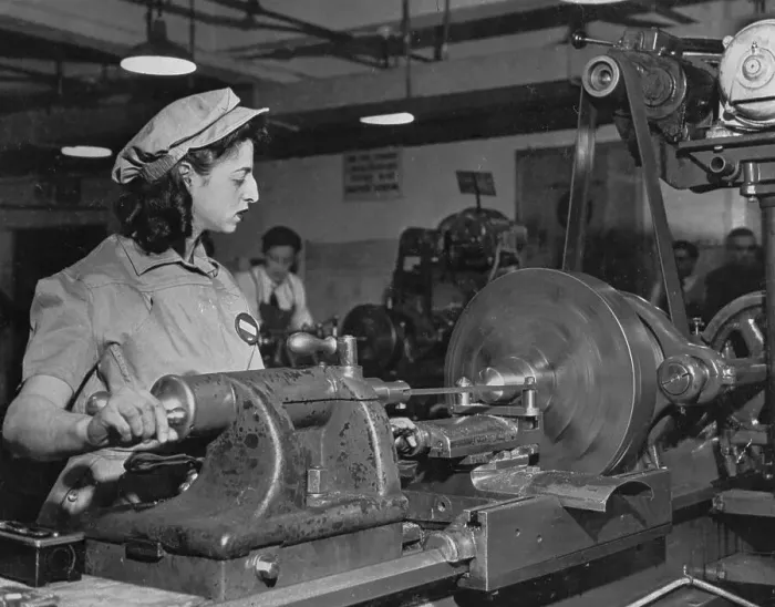 Framed Print : Young Woman Working on Machinery Framed Print : Young Woman Working on Machinery