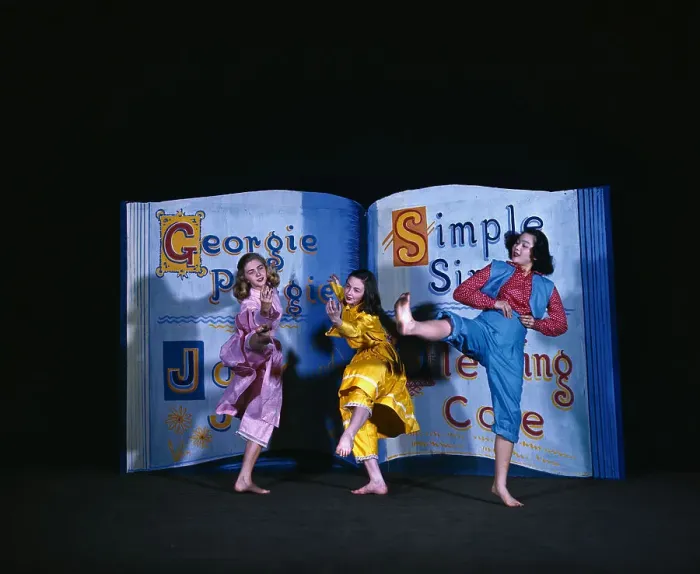 Framed Print : Three Young Women Dancing in Front of Large Prop Framed Print : Three Young Women Dancing in Front of Large Prop