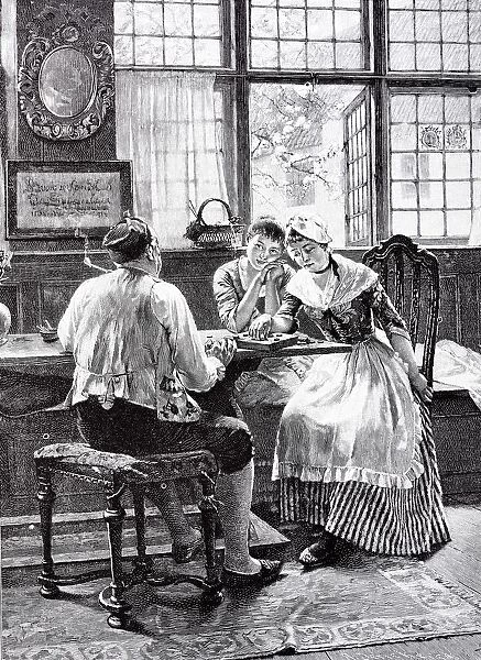 Two young women and an elder man playing a game at table