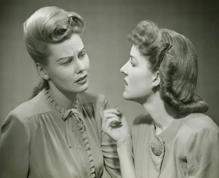 Framed Print : Two young women having serious discussion, (B&W) Framed Print : Two young women having serious discussion, (B&W)