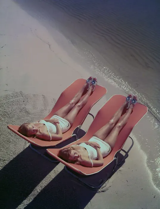 Framed Print : Two Young Women Lounging on the Beach Framed Print : Two Young Women Lounging on the Beach