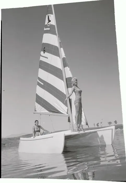 Framed Print : Young Women Posing on Sailboat in Waters Framed Print : Young Women Posing on Sailboat in Waters