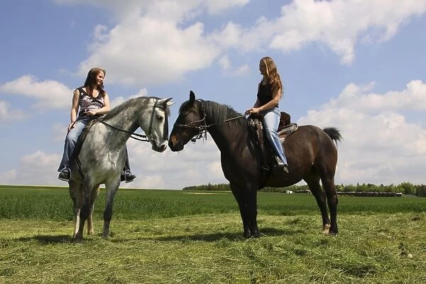 Two young women riding on horseback, Bavaria, Germany, Europe