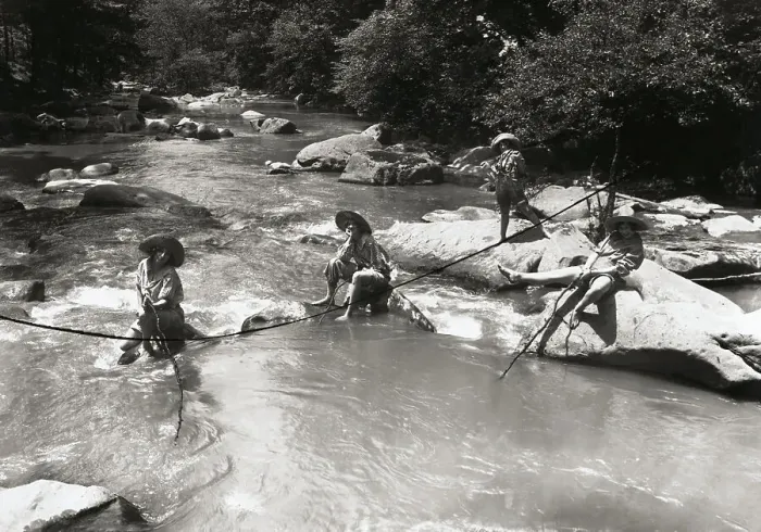 Framed Print : Young Women Sitting on Rocks in Creek Framed Print : Young Women Sitting on Rocks in Creek