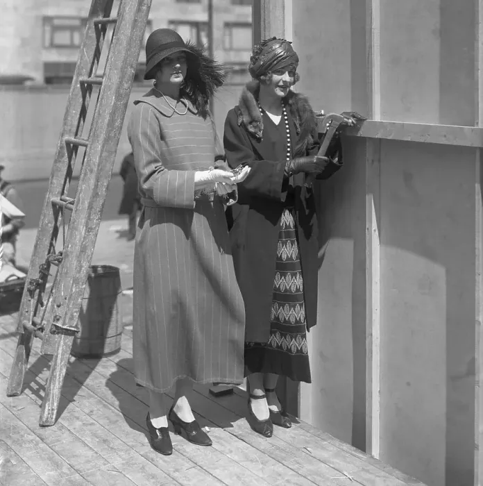 Framed Print : Two young women standing in construction site