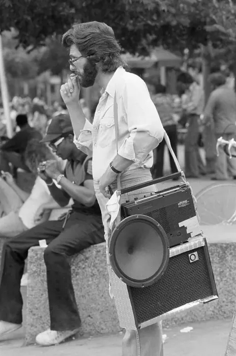 Framed Print : Youngster Carrying Portable Stereo Radio Framed Print : Youngster Carrying Portable Stereo Radio
