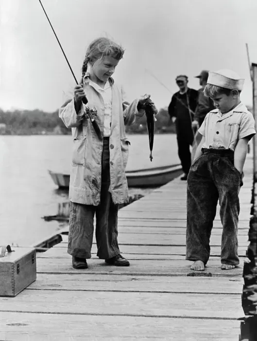 Framed Print : Youngster Displaying Catch on Dock Framed Print : Youngster Displaying Catch on Dock