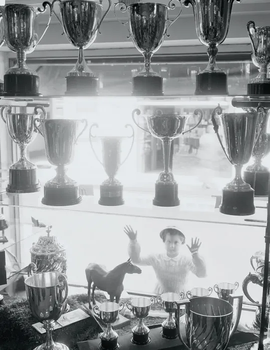 Framed Print : Youngster Gazing into Window at Trophies Framed Print : Youngster Gazing into Window at Trophies