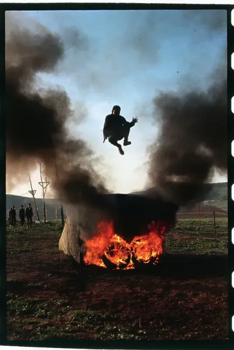 Framed Print : Youngster Jumping Over a Fire Framed Print : Youngster Jumping Over a Fire