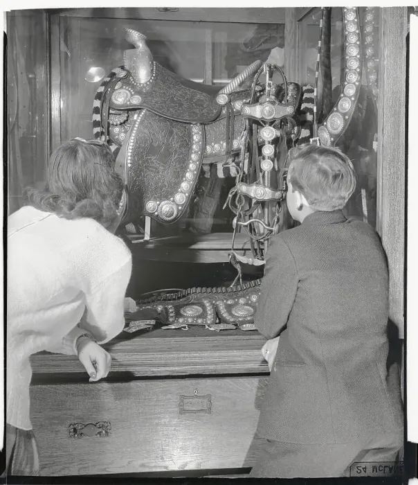 Framed Print : Two Youngsters Admiring Ornate Saddle Framed Print : Two Youngsters Admiring Ornate Saddle