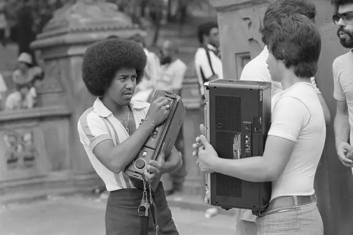 Framed Print : Youngsters Carrying Bulky Audio Equipment
