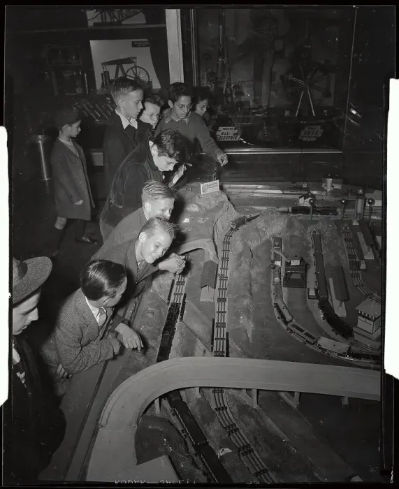 Framed Print : Youngsters Observing Electric Train Set Framed Print : Youngsters Observing Electric Train Set