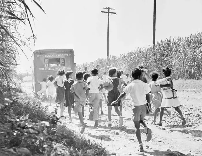 Framed Print : Youngsters Trekking to Book Mobile Parked on Road