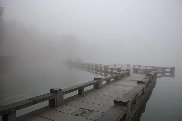 A zig zag bridge on the West Lake in foggy morning, Hangzhou